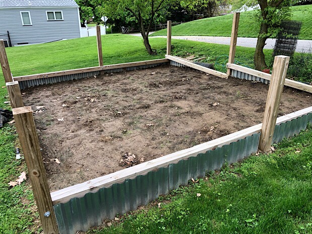 Vegetable garden plot with wood and steel base ready to be tilled