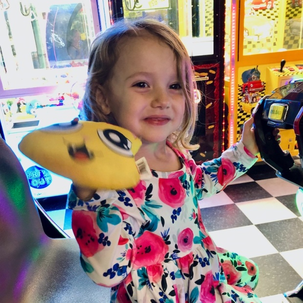 Toddler girl in arcade