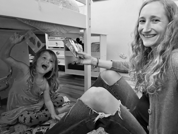 Mom and daughter playing Go Fish black and white picture